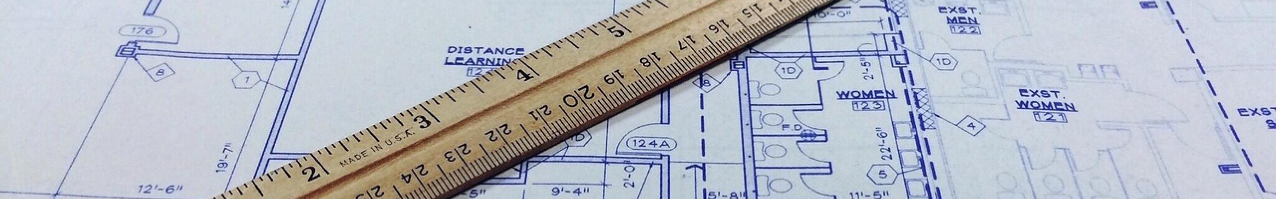 Ruler on top of blueprints. Image by Wokandapix from Pixabay.